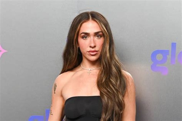 Ariana Biermann Poses In BarelyThere Bathing Suit With Her New Model