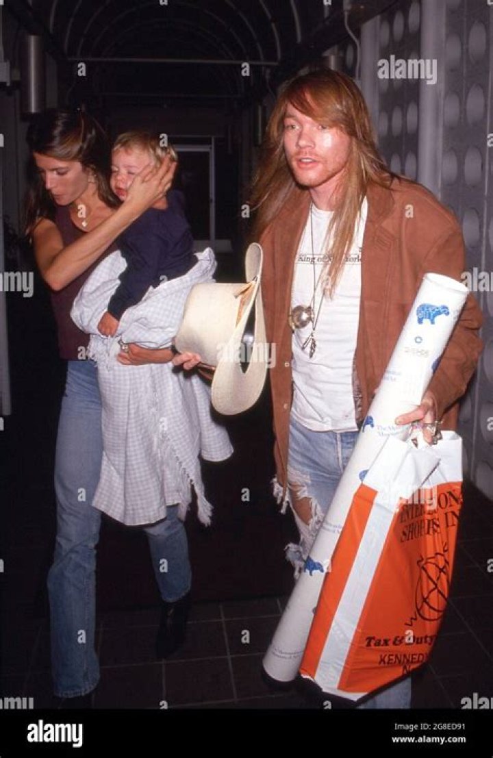 Axl Rose with Stephanie Seymour and her baby son Dylan, early '90s 