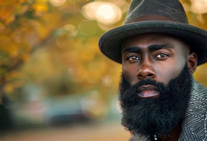 Beard Man with Black Beard, Bearded Gay. Barber with Razor on Black