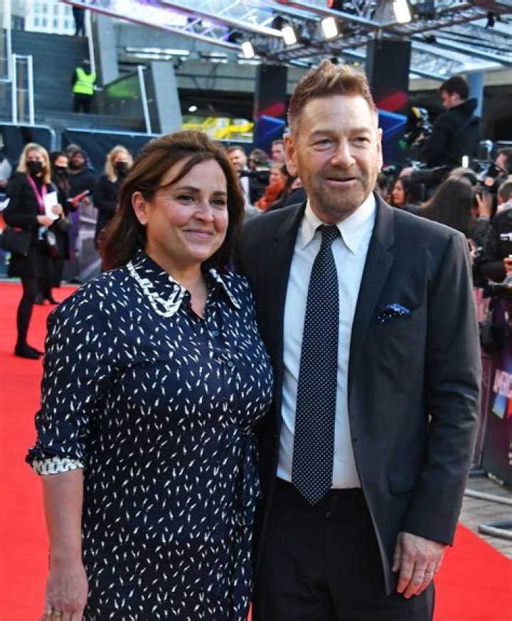 Branagh cosies up to wife Lindsay Brunnock at the London