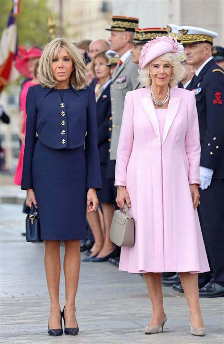 Brigitte's big bonjour! President Macron's wife, 70, greets Queen
