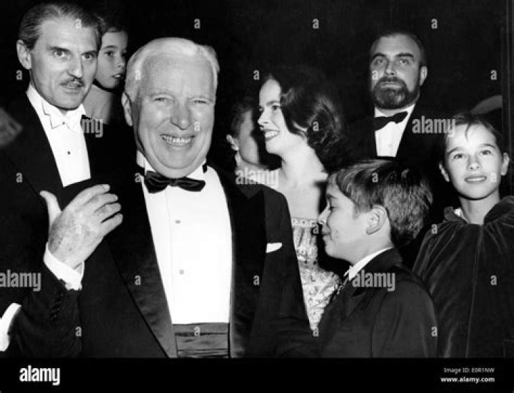 Charlie Chaplin with his son Sydney Chaplin, his fourth wife Oona O