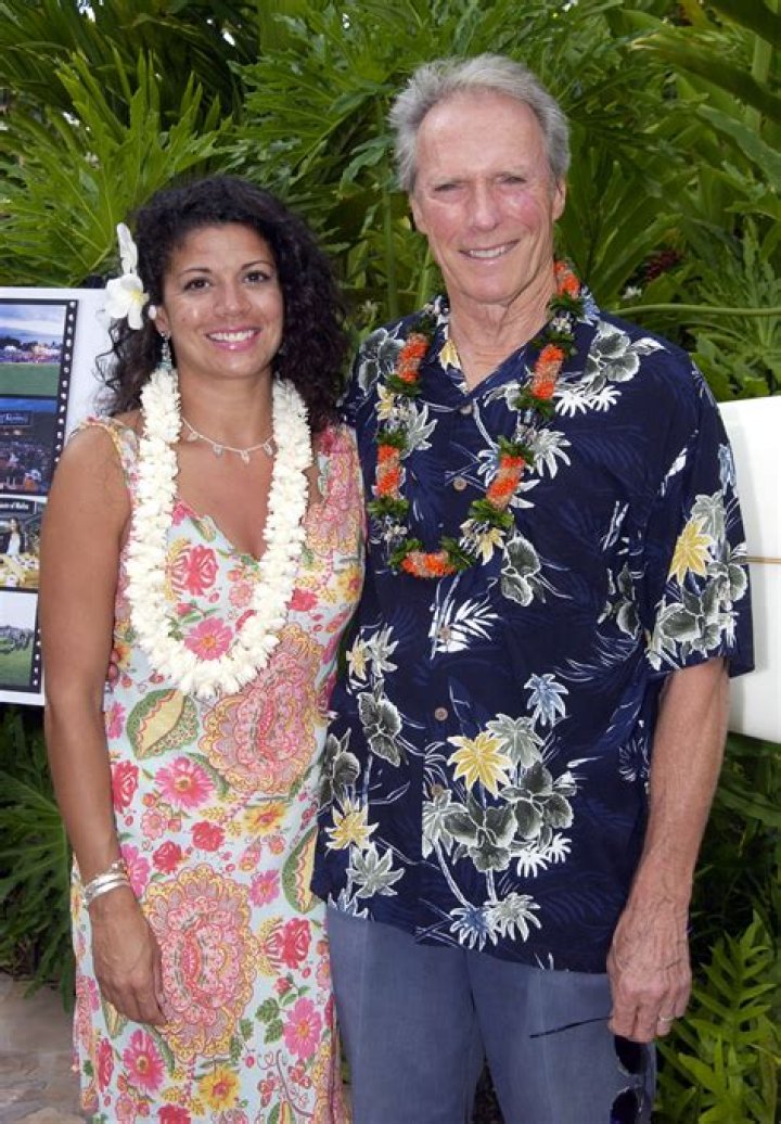 Clint Eastwood & Dina Ruiz Eastwood attend the 'Flags Of Our Fathers
