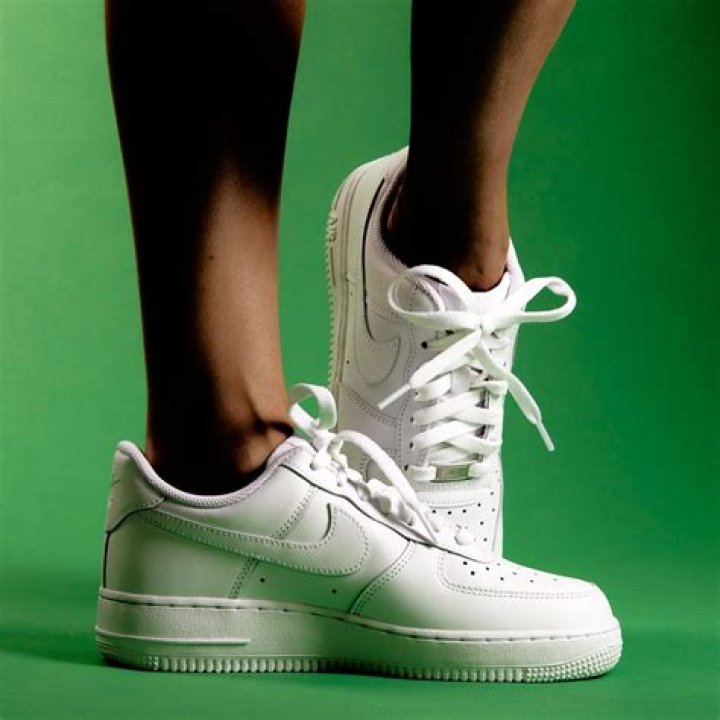 cover your white shoes in toilet paper while drying so they come out