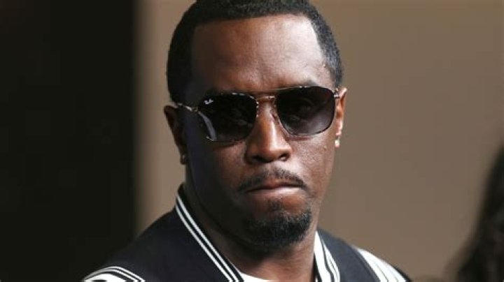 Diddy Looks Devastated At Kim Porter's Funeral As He Sits Alone By Her