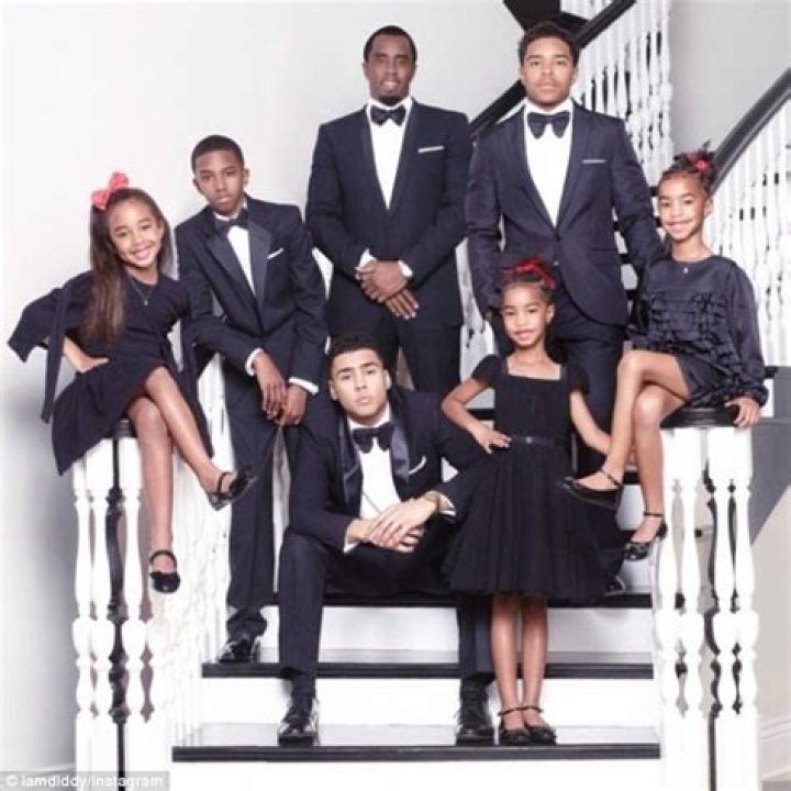 Diddy poses with his six children for family Christmas card... but his