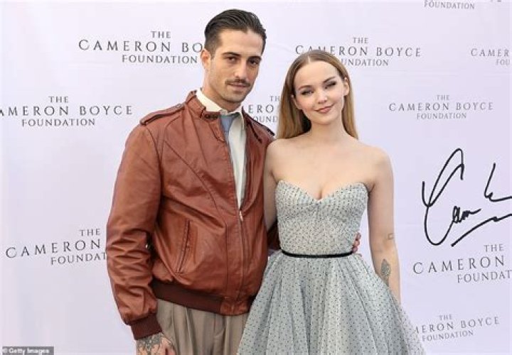 Dove Cameron shares a number of kisses with musician Alexander 23 in