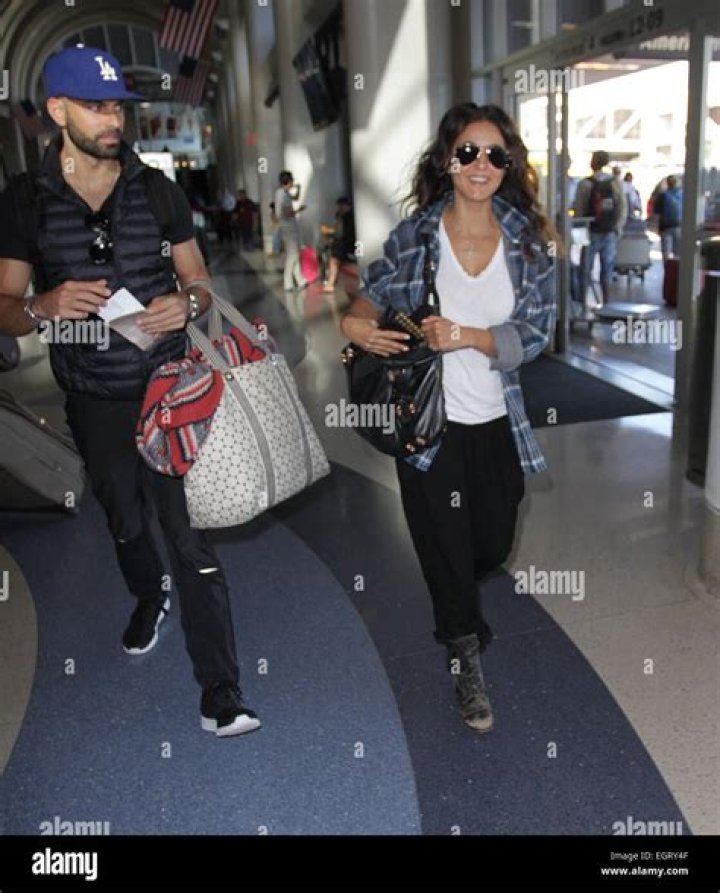Emmanuelle Chriqui with her boyfriend Adrian Bellani depart from Los