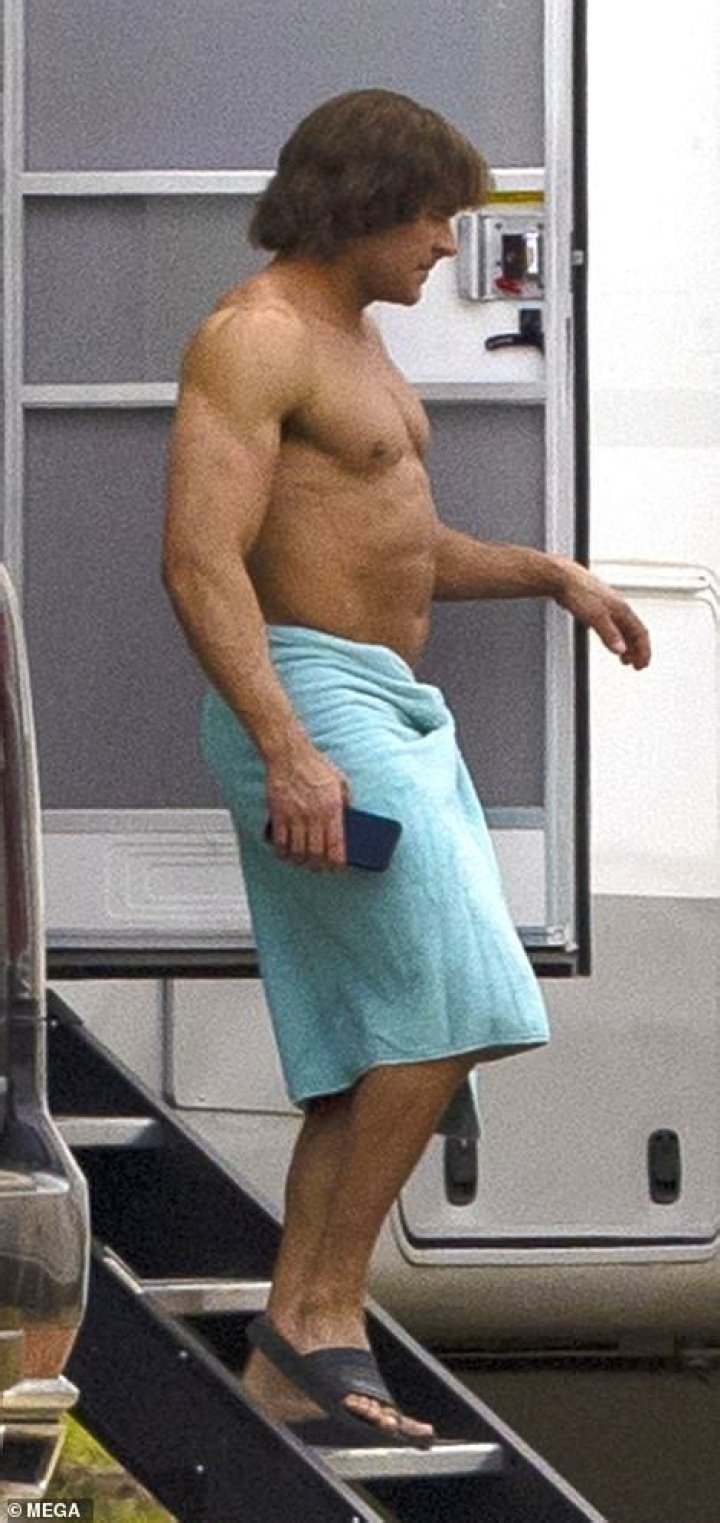 EXC Zac Efron looks UNRECOGNIZABLE as he debuts extremely beefedup