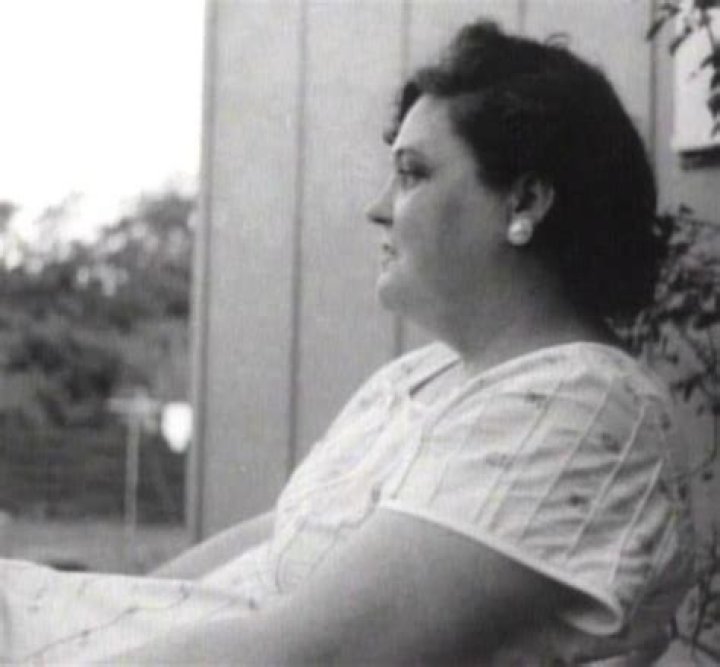 Gladys Presley photographed sitting outside her house at 1034 Audubon