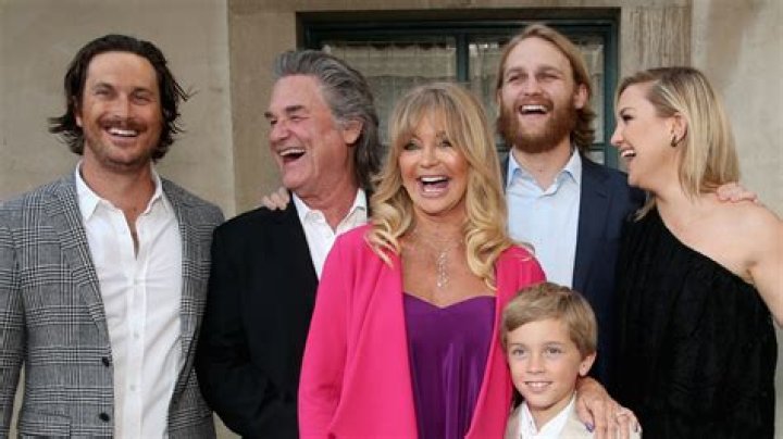 Goldie Hawn lovingly holds longterm beau Kurt Russell by the arm