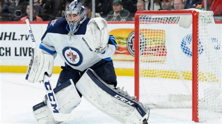 Hellebuyck sets franchise record for wins as Jets edge Devils