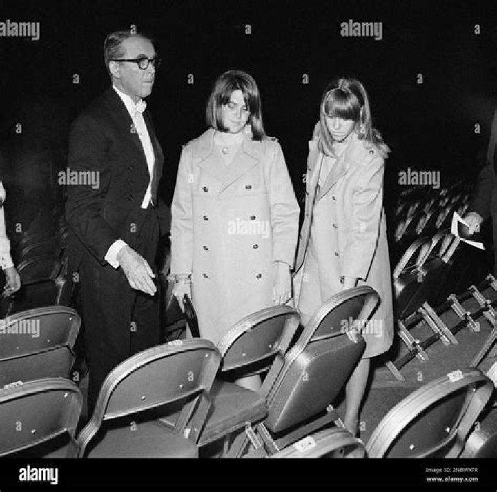 Jimmy Stewart with his twin daughters arriving at...