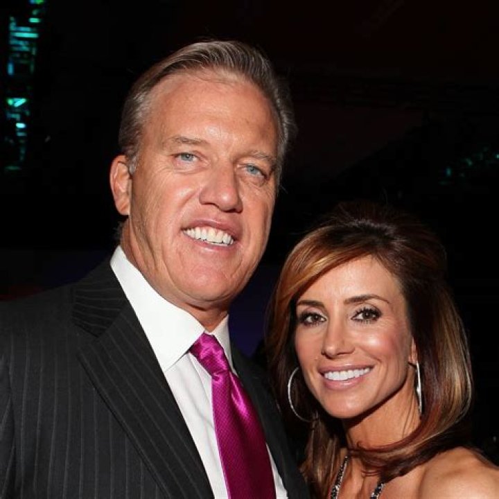 John Elway and his wife Paige at the Flight to Luxury Hangar Event 2012 Fashion, Coat, Lab coat