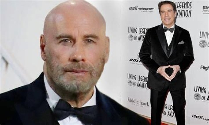 John Travolta debuts new shaved head