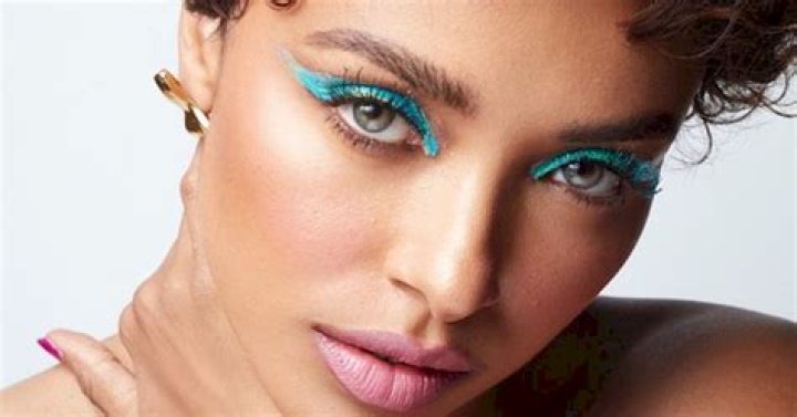 Kat Graham shows skin in netted thighhighslit dress as she attends