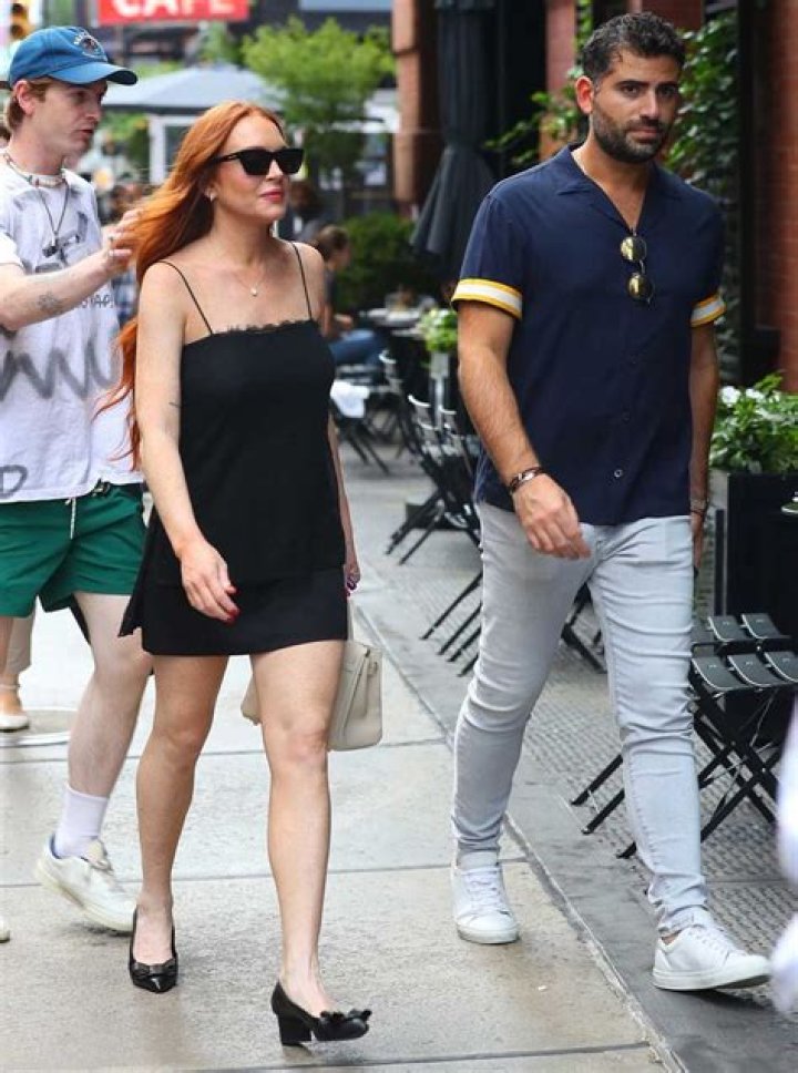 Lindsay Lohan and Husband Bader Shammas Smile as They Sit Courtside at