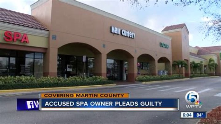 Massage parlor owner pleads guilty
