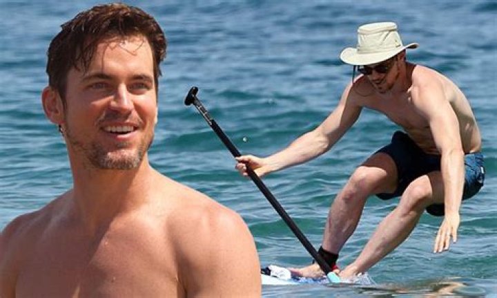 Matt Bomer shirtless while paddleboarding with husband Simon Halls