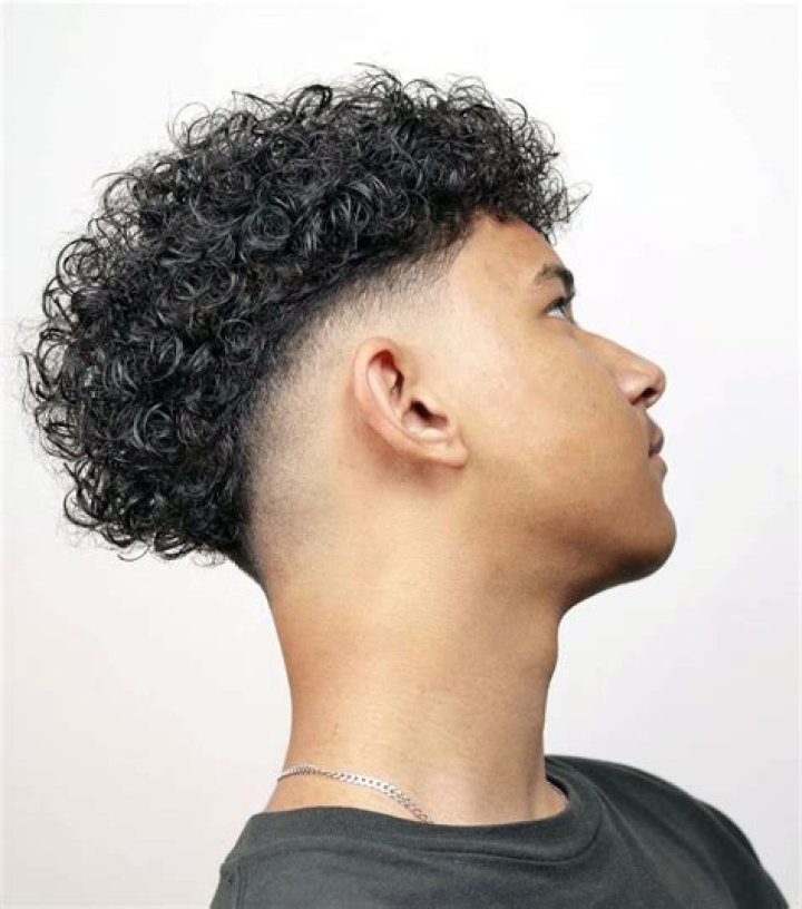 Mid fade with Curls My boy got a mid/low drop fade and left the top