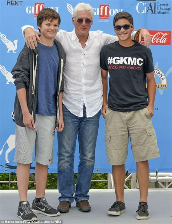 Richard Gere is joined by son Homer James Jigme as he receives prize