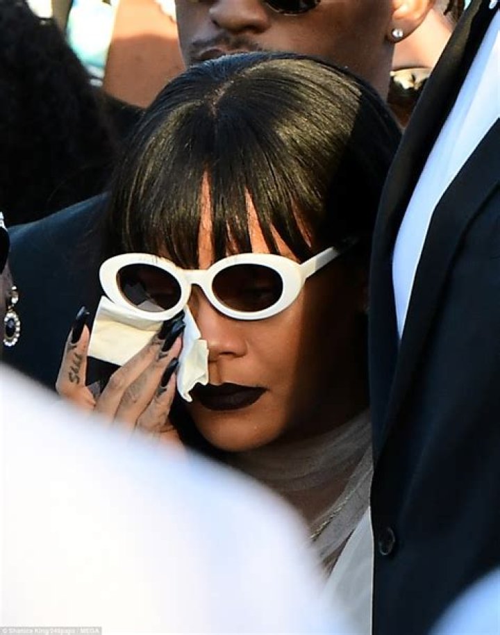 Rihanna wipes away tears at funeral of herc ousin Tavon Alleyne, 21