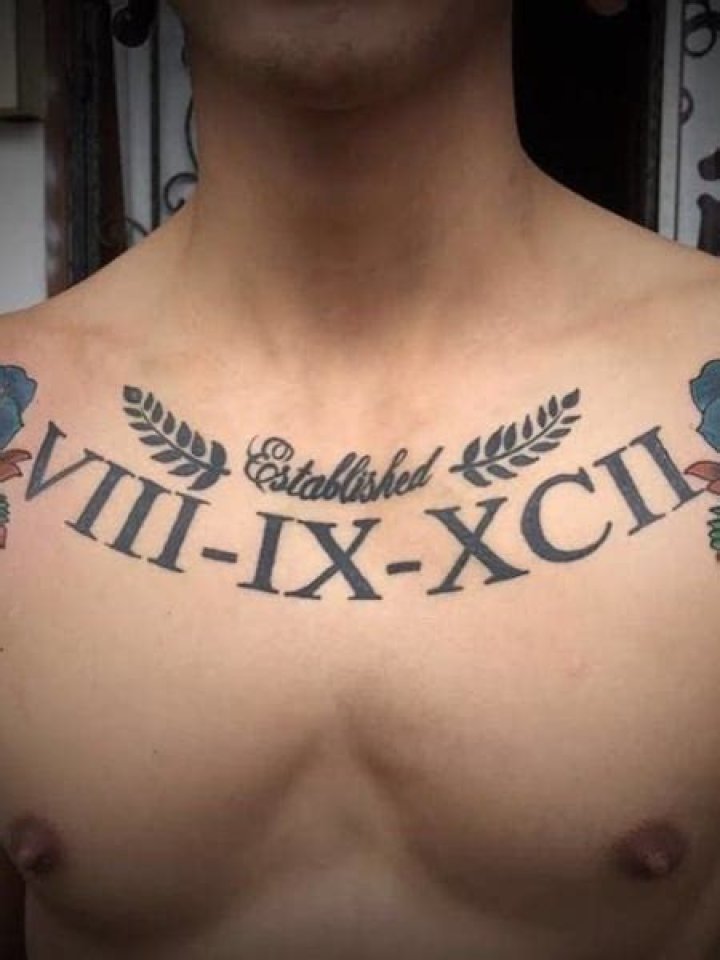 Roman Numerals Upper Chest Tattoo For Guys With Small Design 