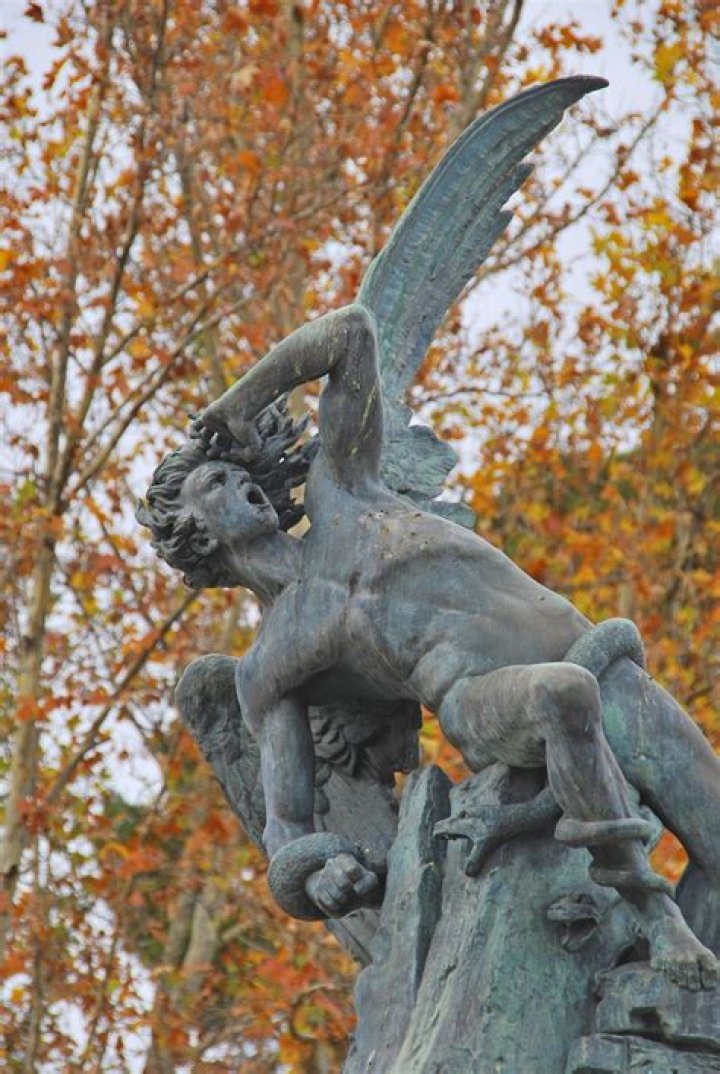 Statue of the Fallen Angel, Retiro Park (Madrid, Spain). Fallen angel