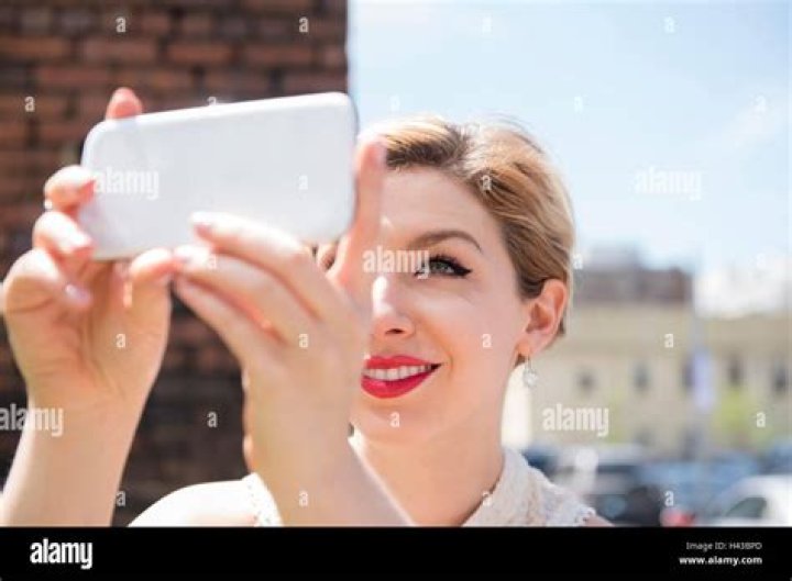 Stylish Women Posing with Cell Phone