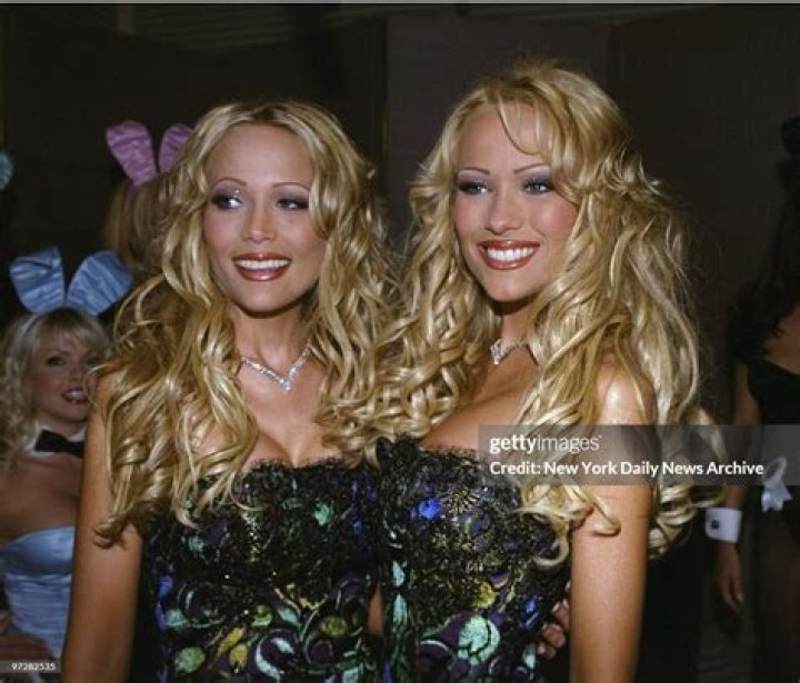 Twins Mandy and Sandy Bentley with Hugh Hefner at a press conference
