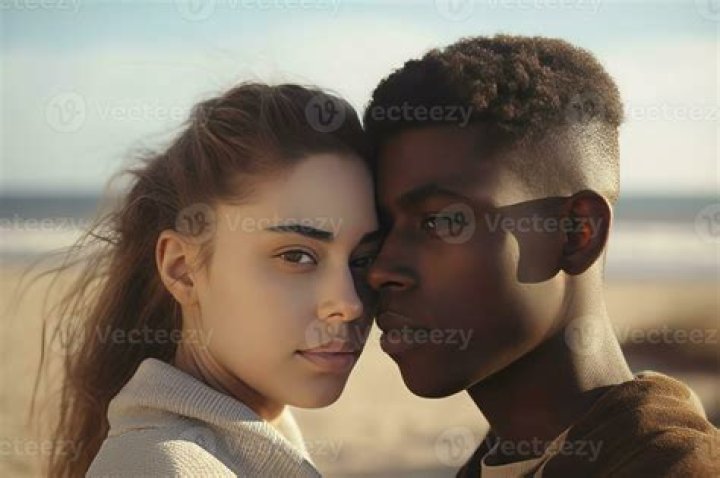 Young interracial couple in love on Valentine's day posing while